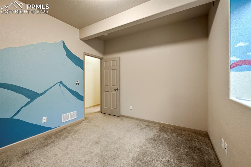 Image 16 of 22: Carpeted empty room featuring baseboards and visible vents