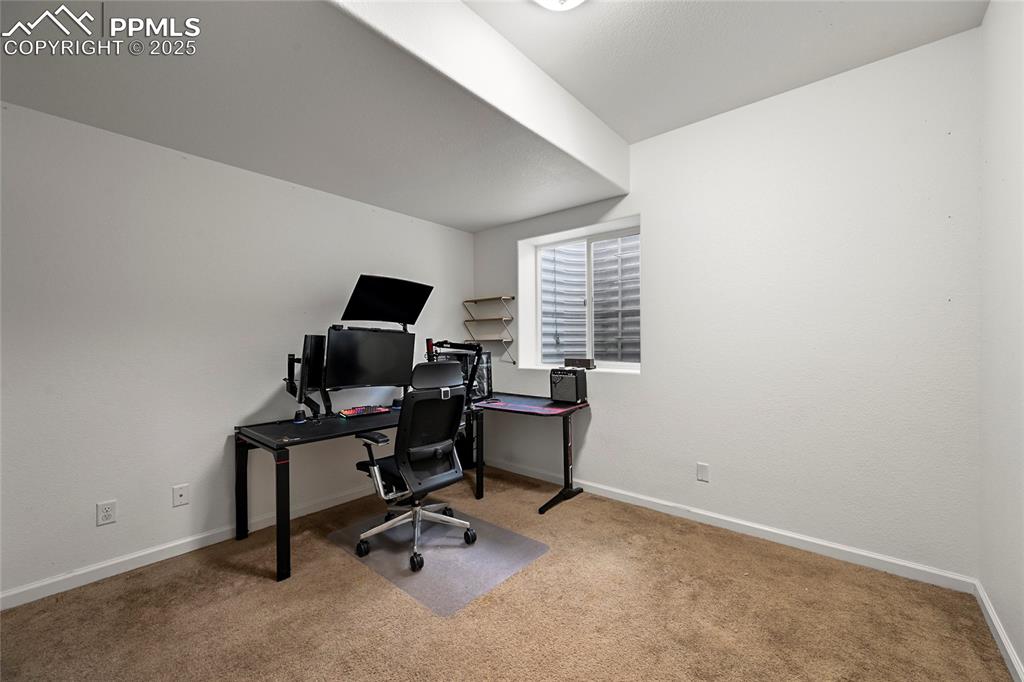 Image 18 of 22: Office space featuring baseboards and carpet flooring