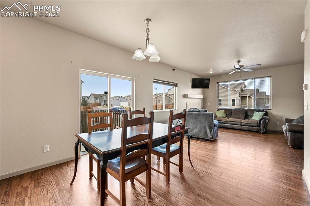 Image 5 of 22: Dining space featuring ceiling fan, baseboards, and wood finished floors