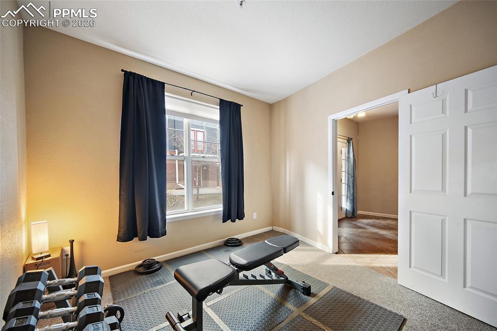 Image 22 of 49: Main level Bonus room can be a home office, guest bedroom, Home Gym plus a 