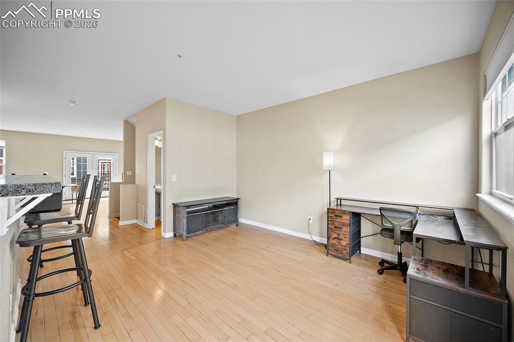 Image 25 of 49: This area is being used as an office area.  Could be a sitting area, mount 