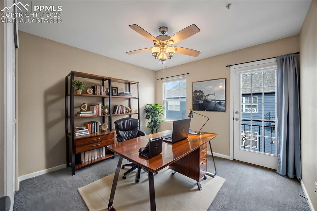 Image 42 of 49: virtually staged - One of the bedrooms being staged as an office. 