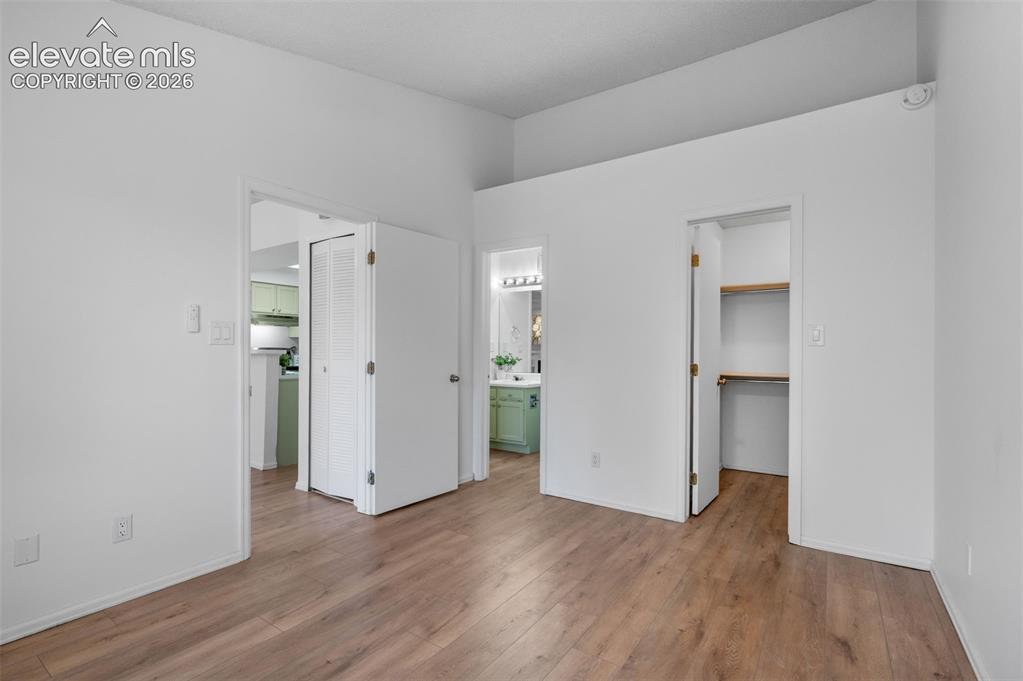 Image 18 of 35: Doors (Left to right) living space, bathroom, & walk-in closet