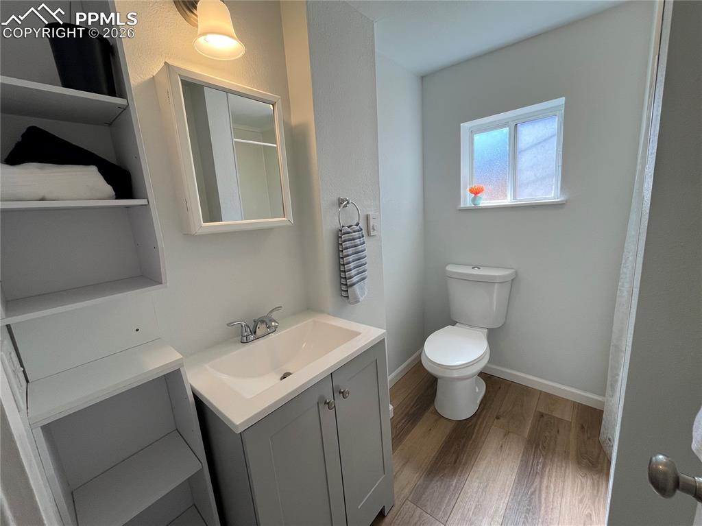 Image 11 of 30: Cottage Bathroom with new vanity and storage