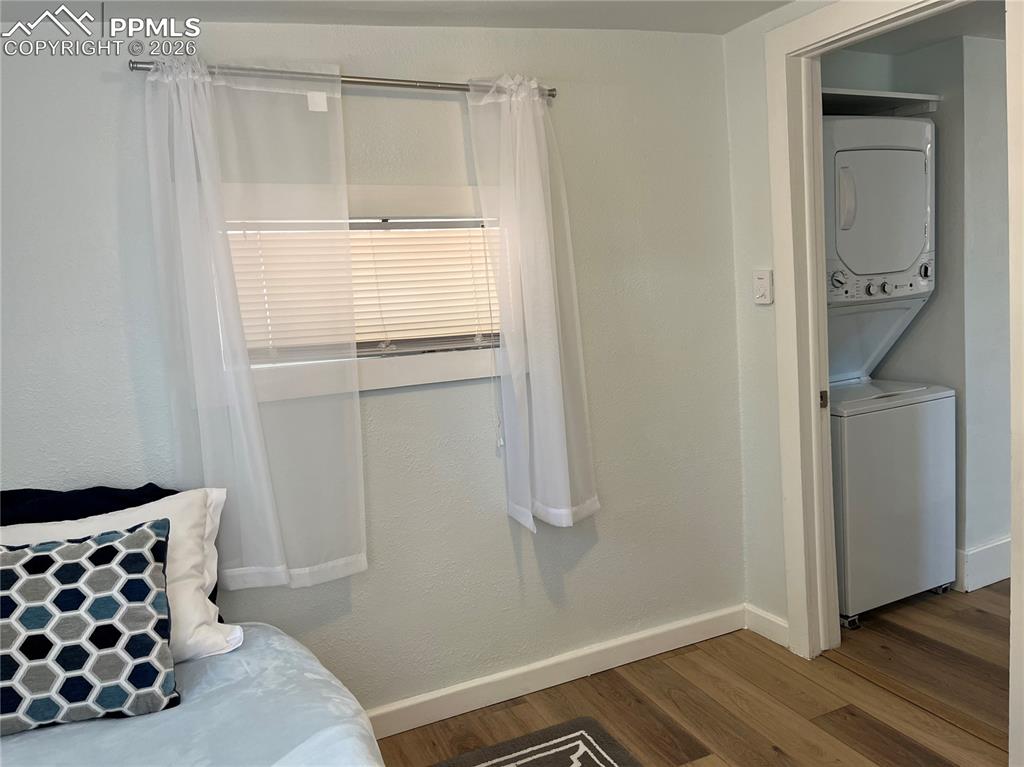 Image 13 of 30: Cottage New Stackable Washer / Dryer next to bedroom