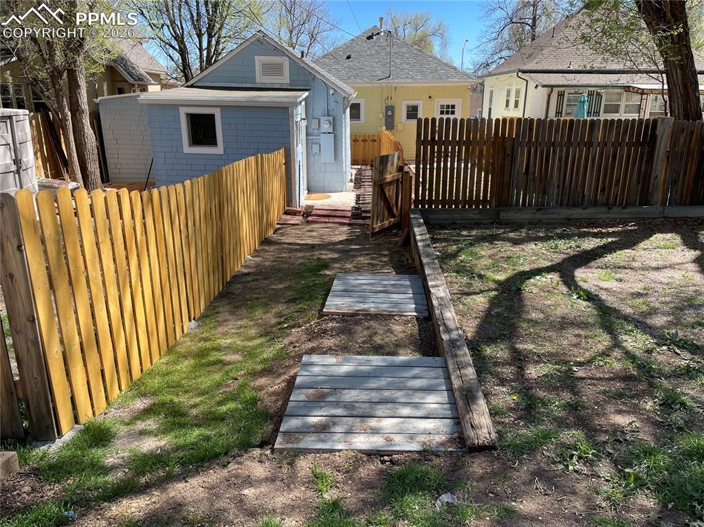 Image 17 of 30: Cottage Fenced Backyard