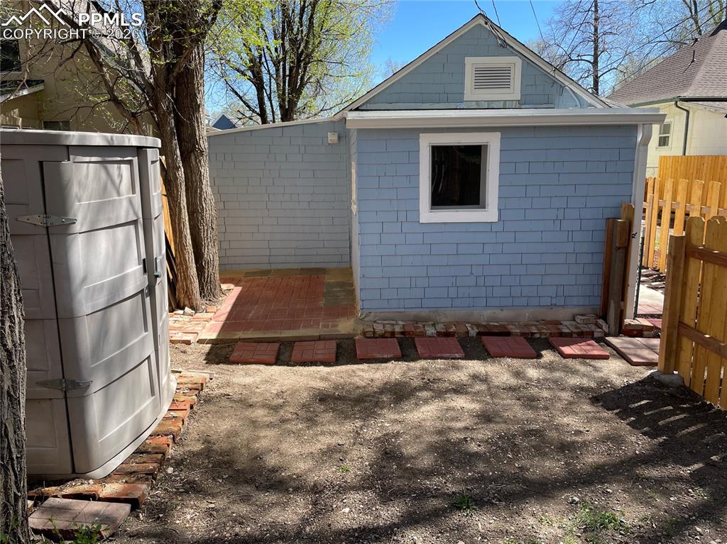 Image 18 of 30: Cottage Private Back Patio and storage shed