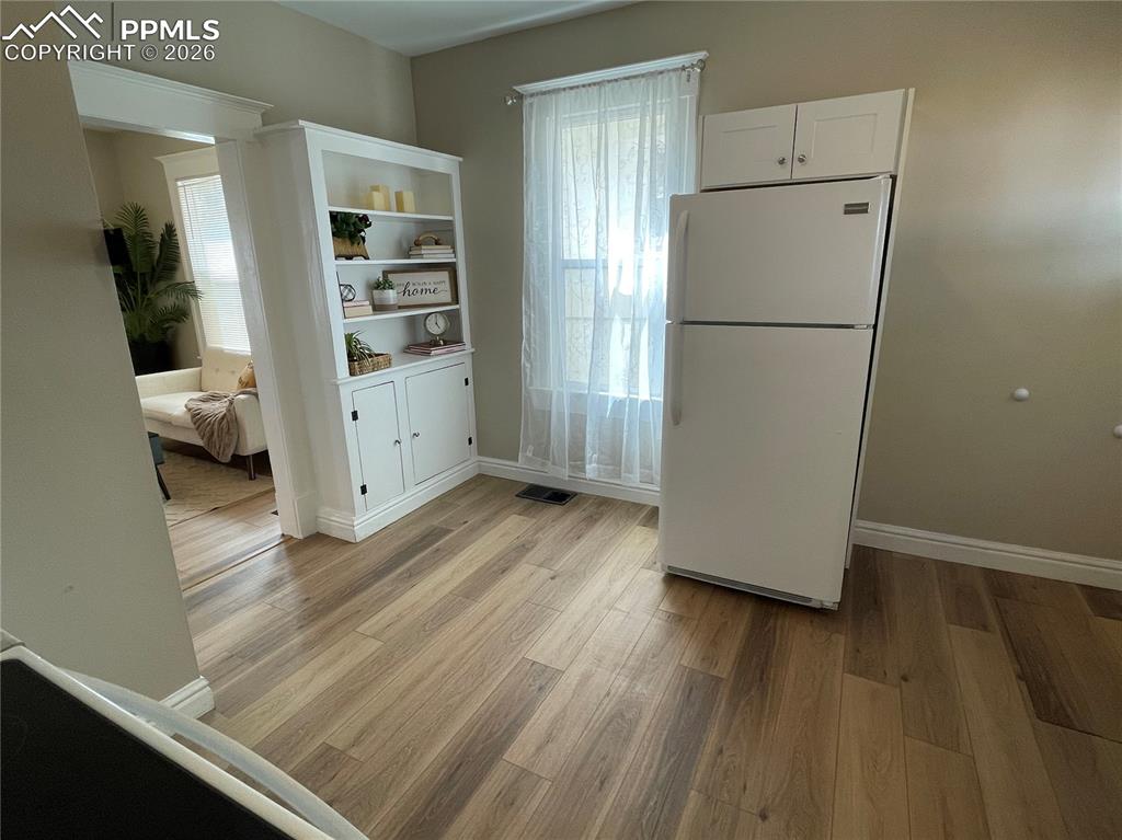 Image 21 of 30: House Built-in bookcase and fridge