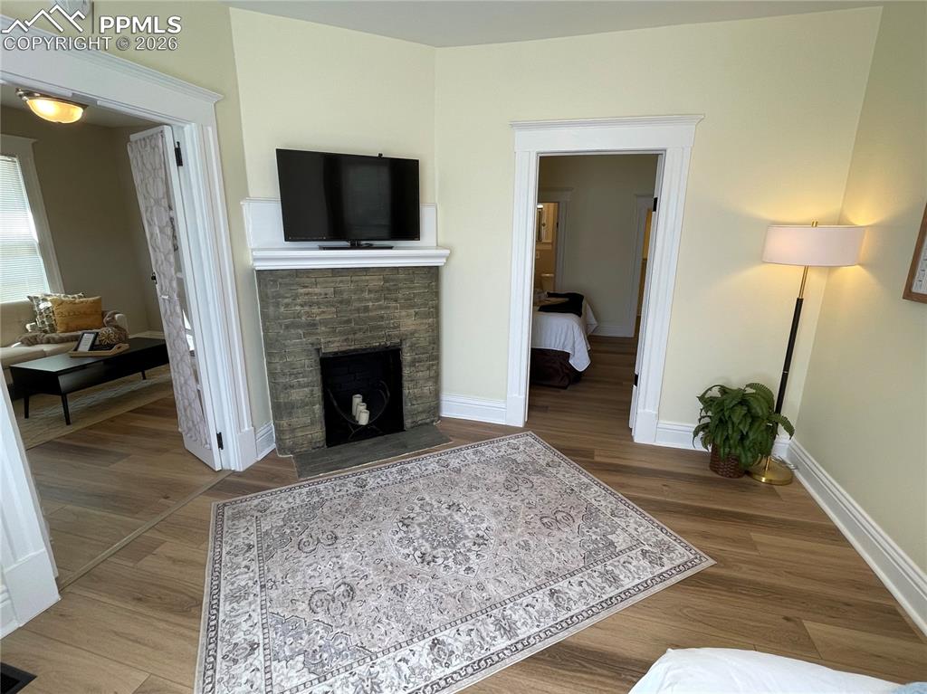 Image 25 of 30: House Bedroom 2 - original fireplace is decorative only! 