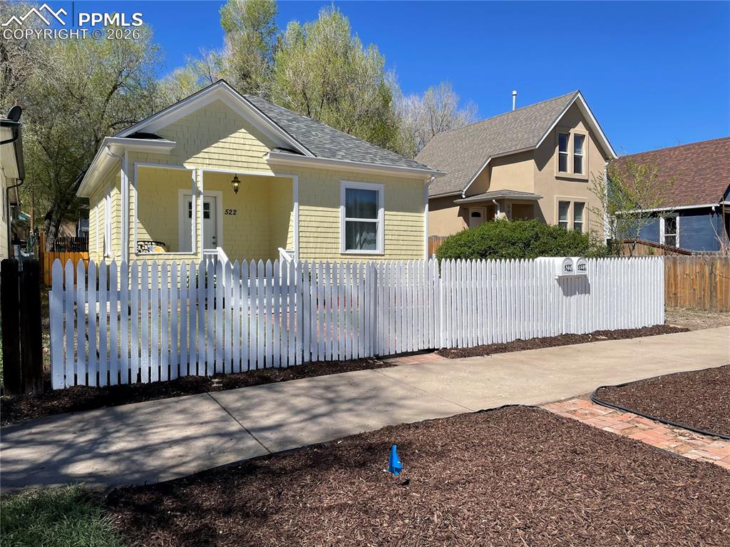 Image 29 of 30: House with wide sidewalk