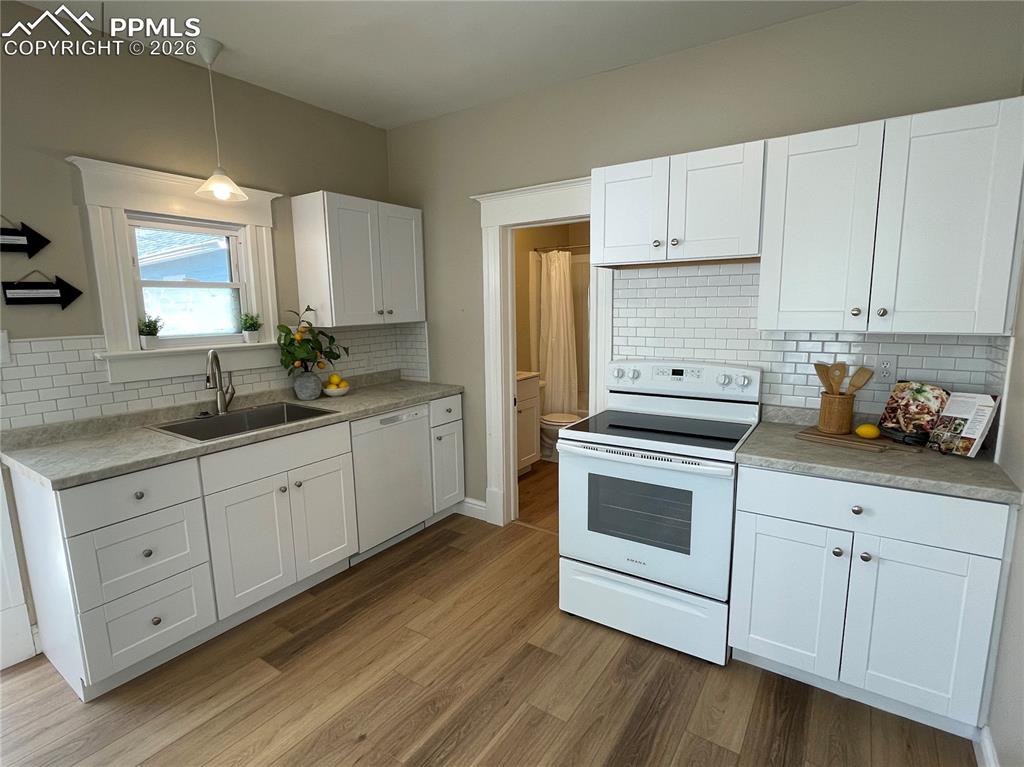 Image 3 of 30: House Kitchen with new dishwasher and stove/range
