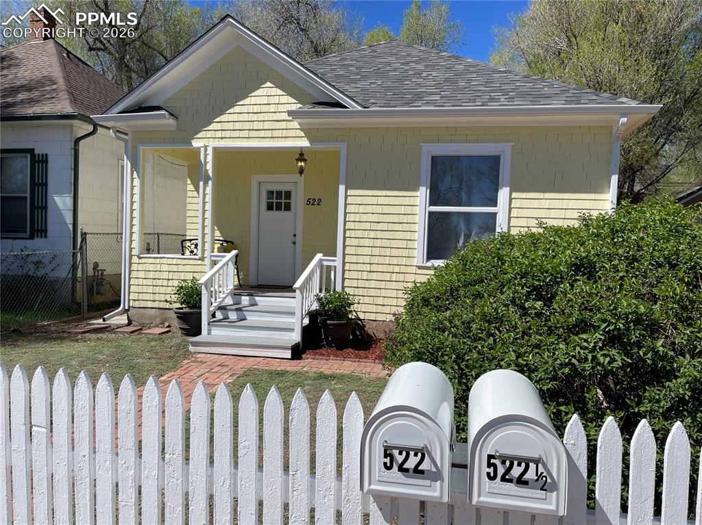Image 30 of 30: House with two separate locking mailboxes.