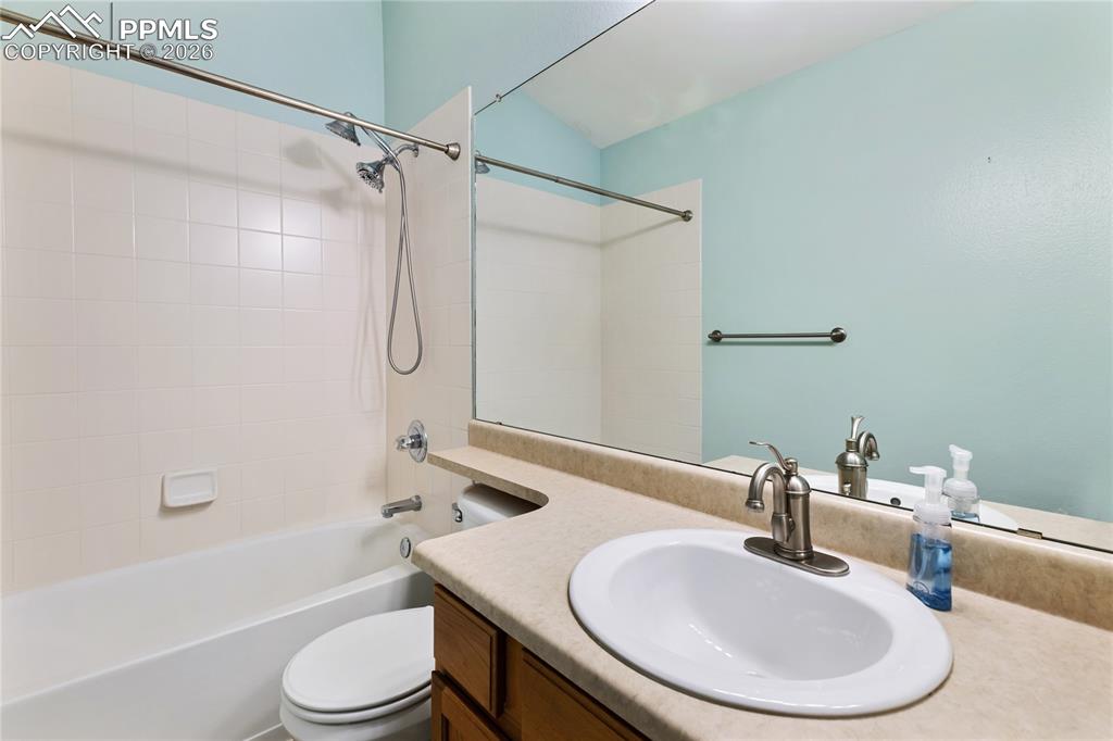 Image 23 of 36: Full bath featuring vanity and shower combination