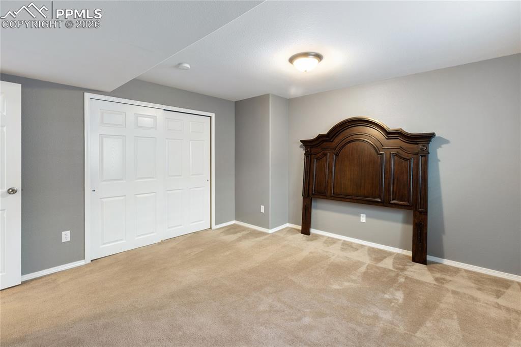 Image 32 of 36: Unfurnished bedroom with a closet and light colored carpet