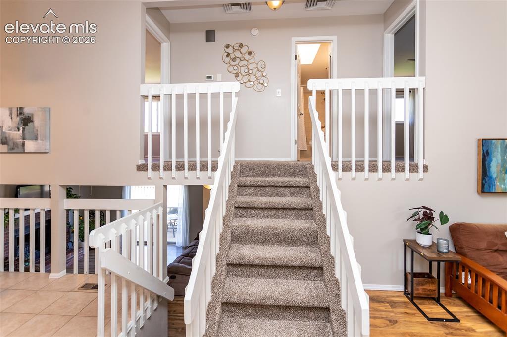Image 12 of 40: Layout has an open concept amid defined spaces.