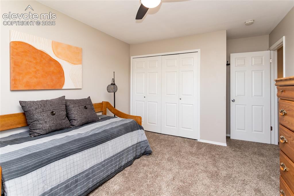 Image 20 of 40: Large upper level second bedroom has a large closet.