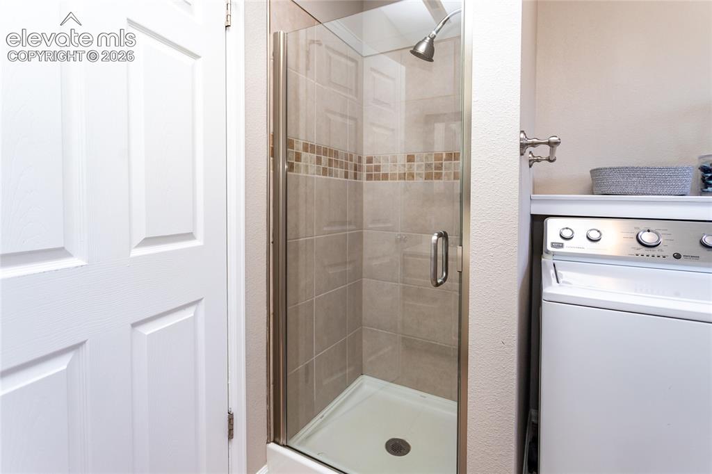 Image 26 of 40: Lower level bath has 3/4 shower.