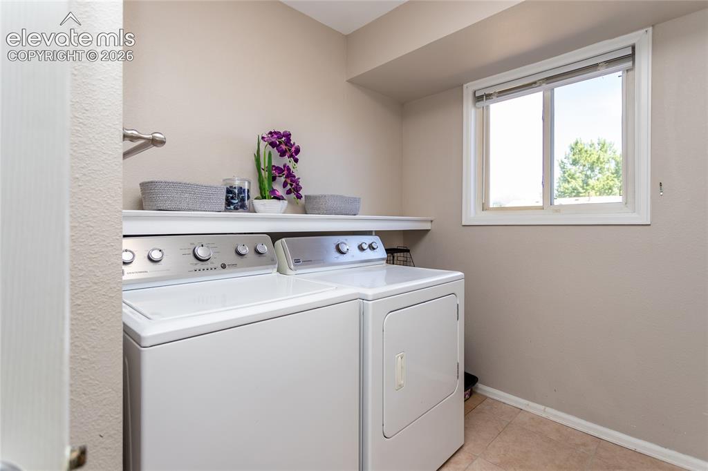 Image 27 of 40: Laundry is located in the lower level bathroom.