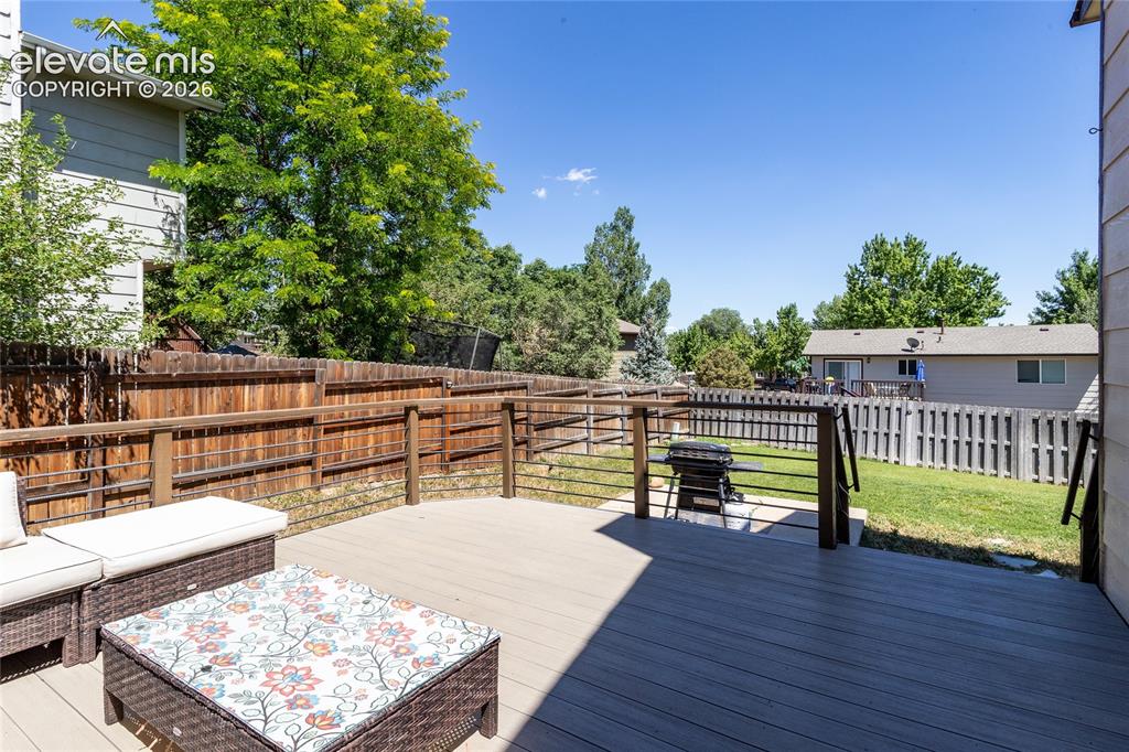 Image 31 of 40: Upper deck view to the back yard.