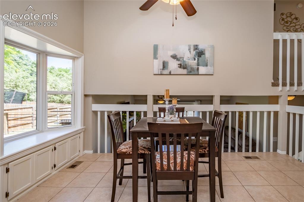 Image 8 of 40: Dining room has beautiful bay window.