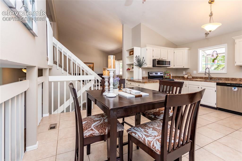 Image 9 of 40: Dining room is open to the kitchen.