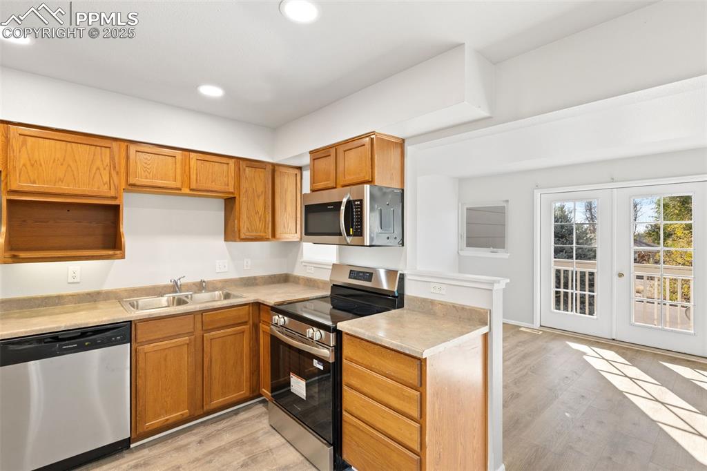 Image 10 of 34: Kitchen Opens Up to Dining Area and Living Room!