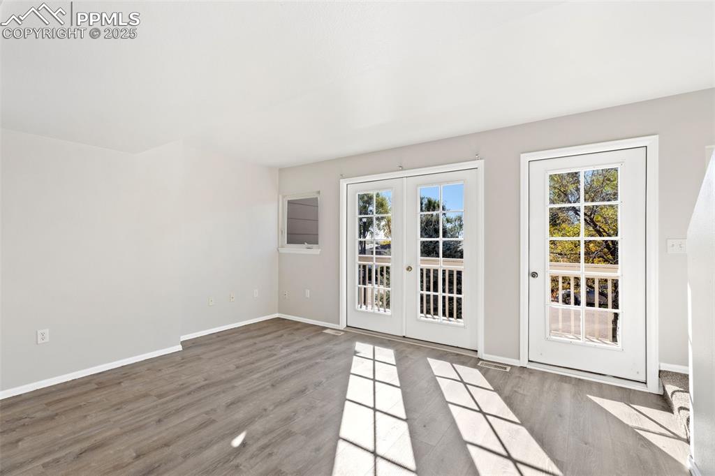 Image 13 of 34: French Doors Lead to Balcony!