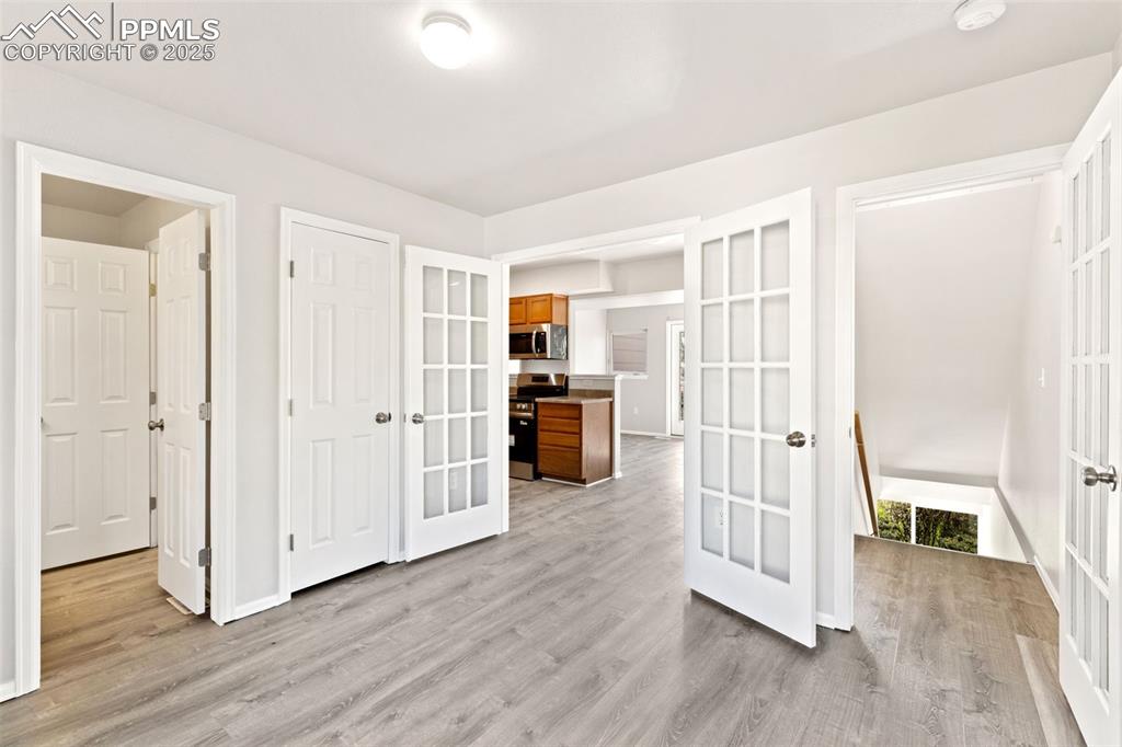 Image 15 of 34: Main Level Bedroom with French Doors!