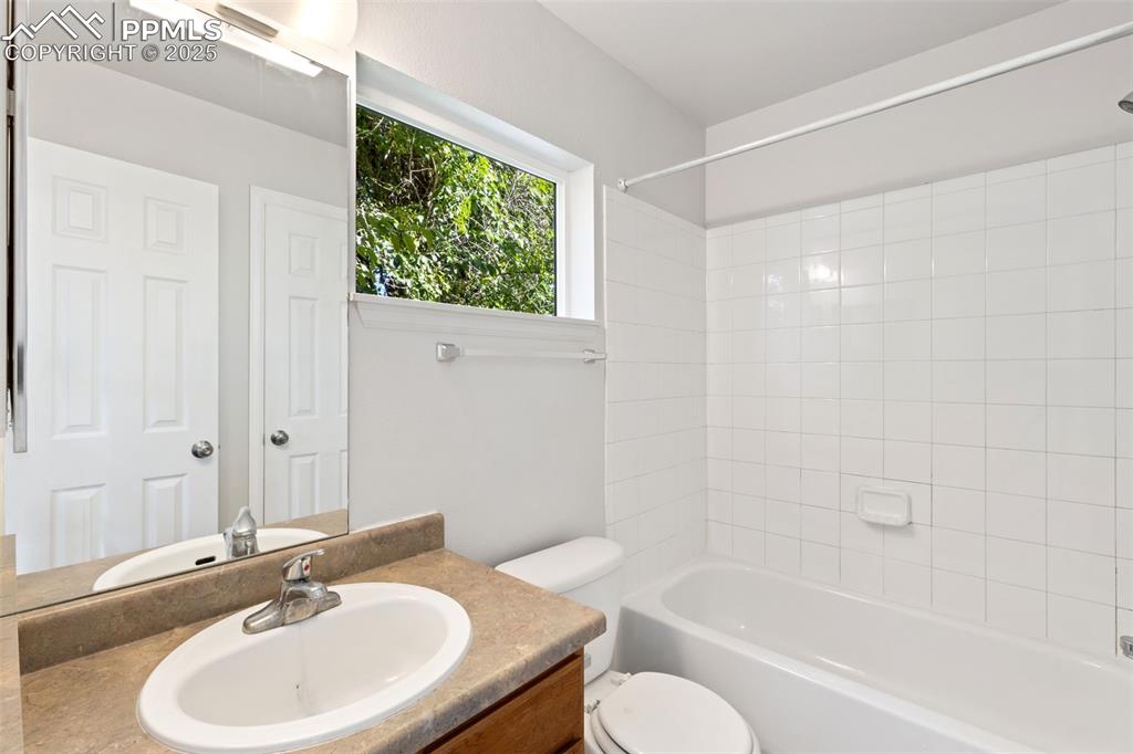 Image 17 of 34: Main Level En Suite Full Bathroom with Dual Access!