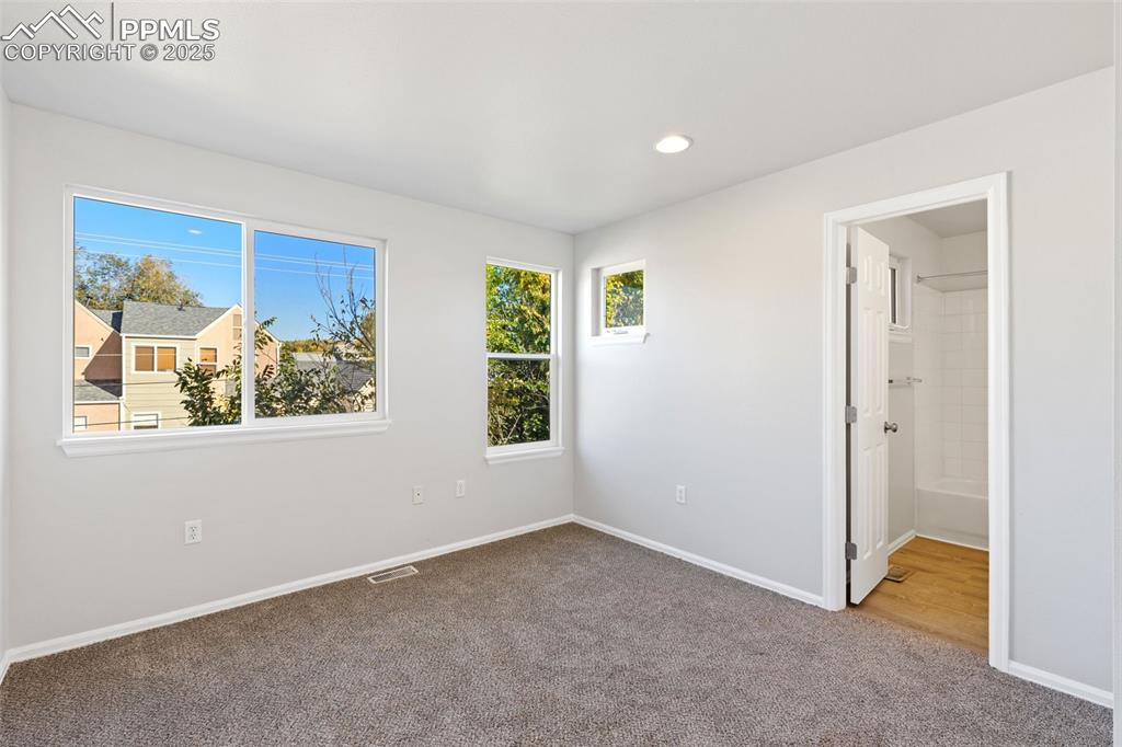 Image 21 of 34: Secondary Upper Level Bedroom!