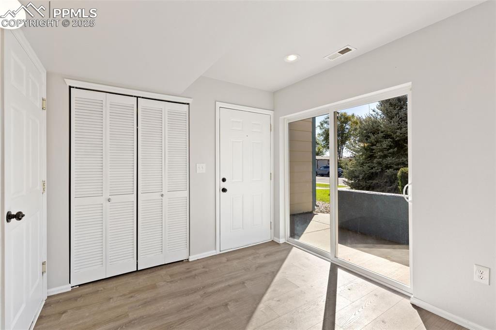 Image 4 of 34: Entry Area! Access to the Garage and the Front of the Townhome!