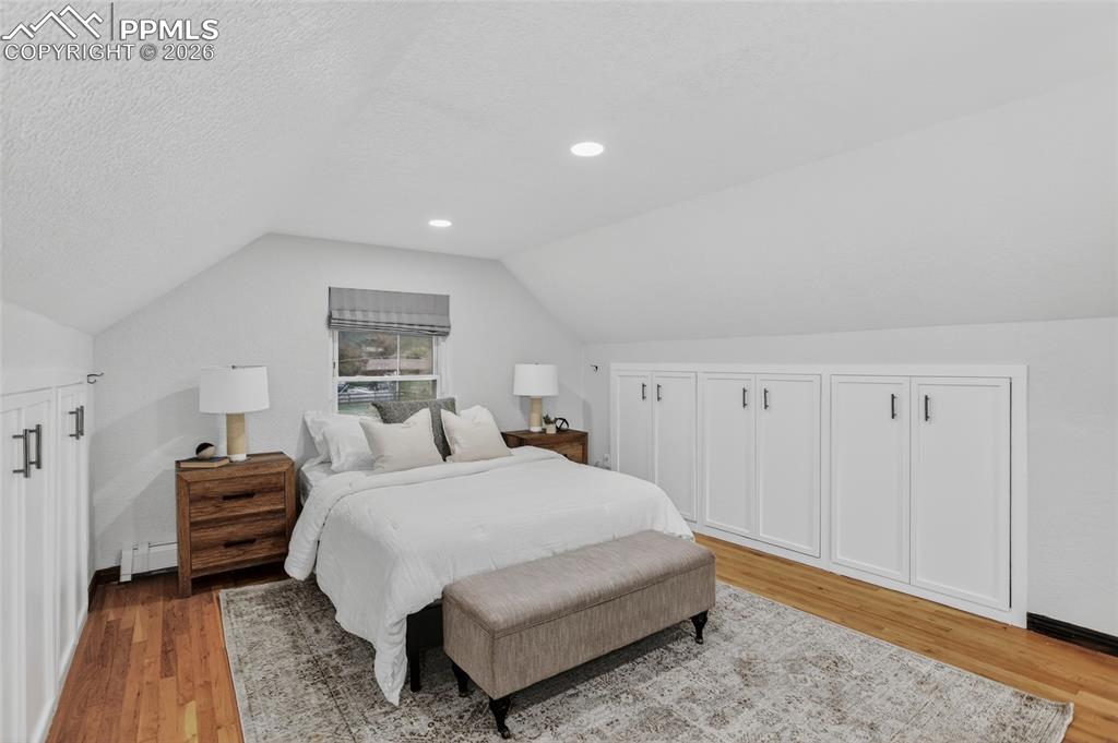 Image 21 of 49: Primary bedroom with built-ins