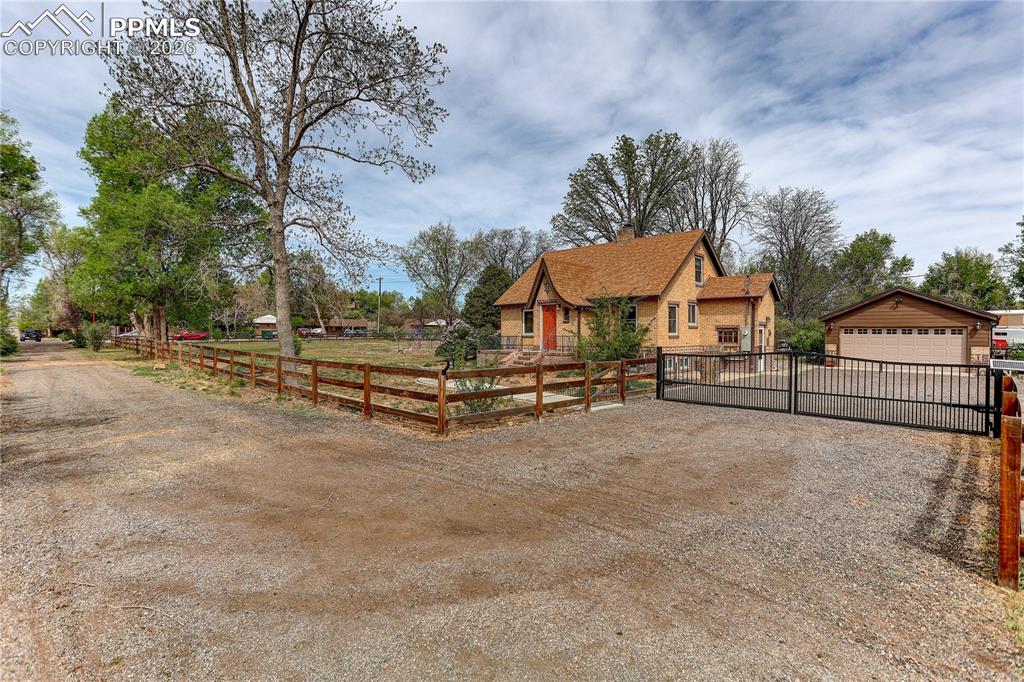 Image 40 of 49: Driveway with private electronic gate access