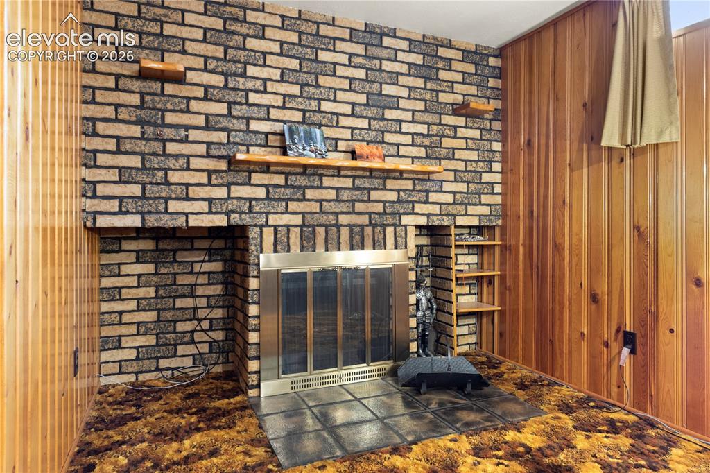 Image 13 of 49: Basement Den Living Room