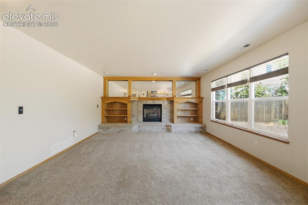 Image 10 of 35: Lovely gas fireplace