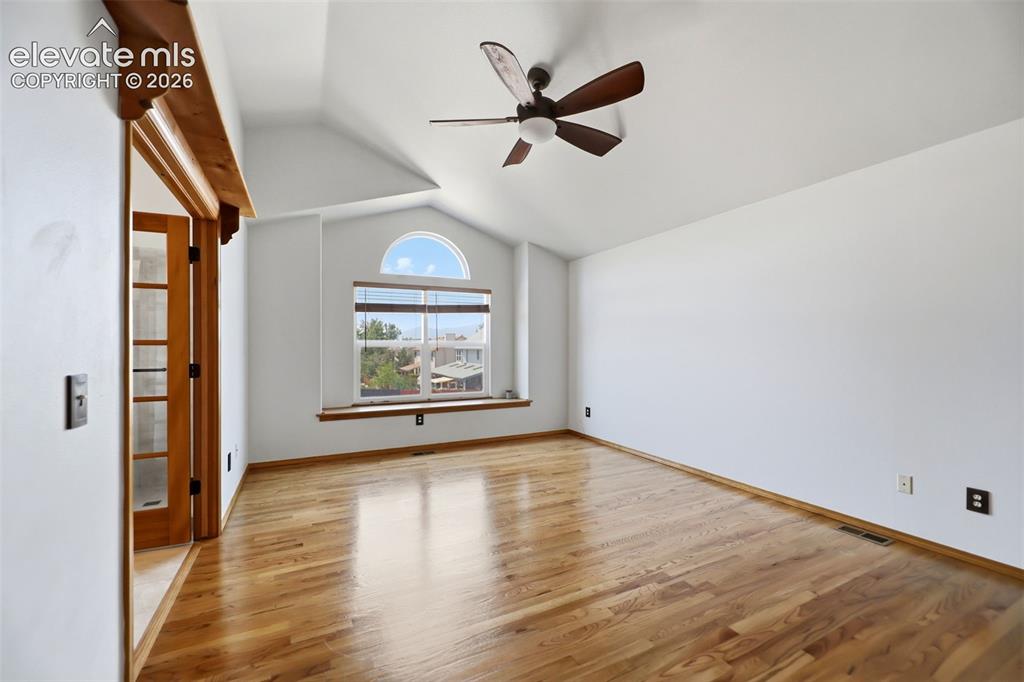 Image 15 of 35: Flooded with natural light and vaulted ceilings