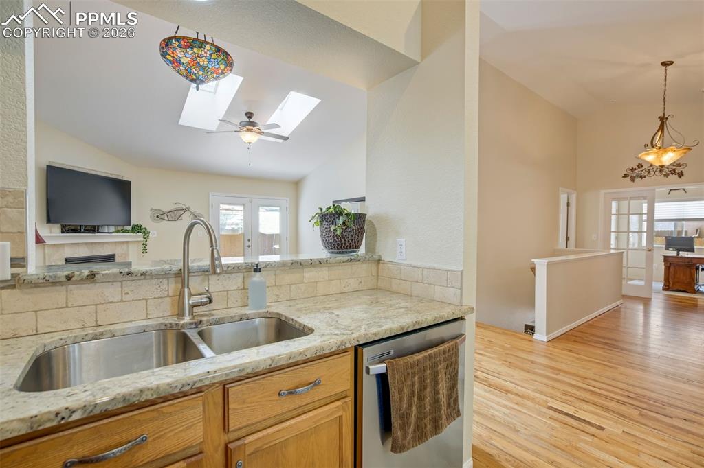 Image 15 of 50: Stylish finishes include a tile backsplash, upgraded fixtures, and quality 