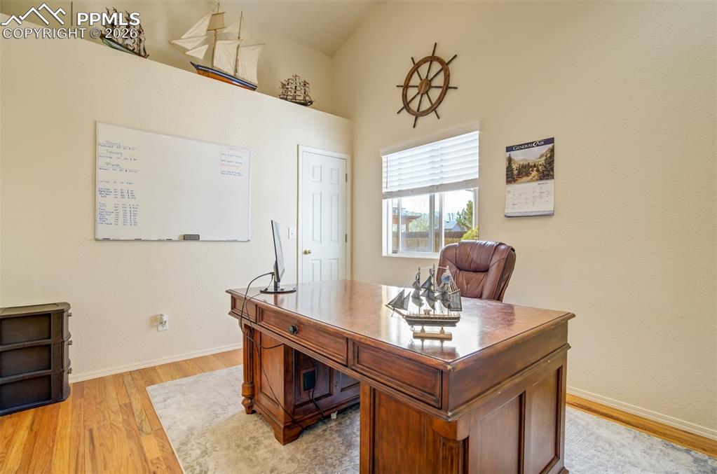 Image 20 of 50: Dedicated office space with high ceilings and large windows, perfect for wo