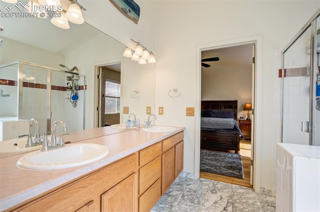 Image 25 of 50: Vaulted ceilings, skylights, and Spacious primary bath featuring dual vanit