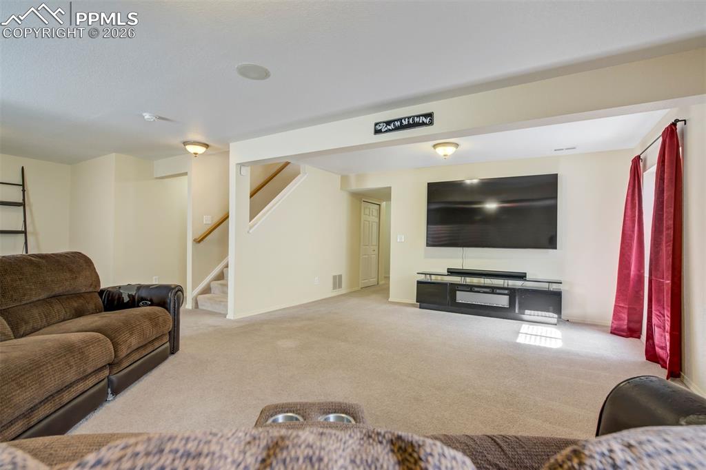 Image 32 of 50: Designed with relaxation in mind, this space is ideal for a home theater se