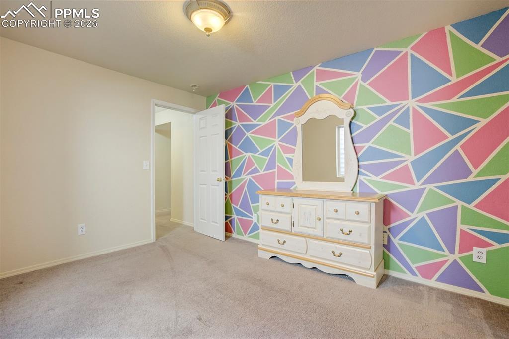 Image 39 of 50: Another angle showcases the room’s functionality, including ample wall spac