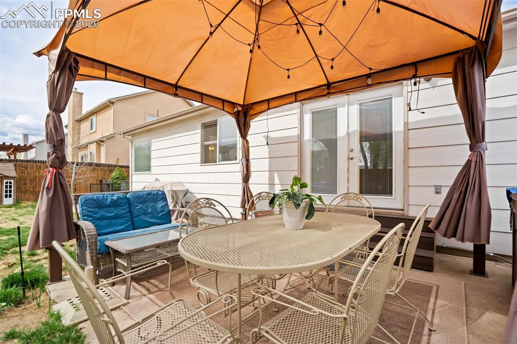 Image 44 of 50: Step into your private outdoor retreat featuring a covered gazebo—perfect f