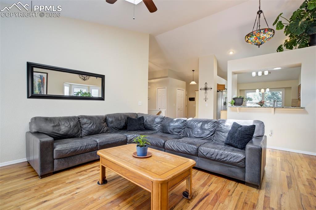 Image 7 of 50: Spacious living room featuring beautiful hardwood floors and an open layout