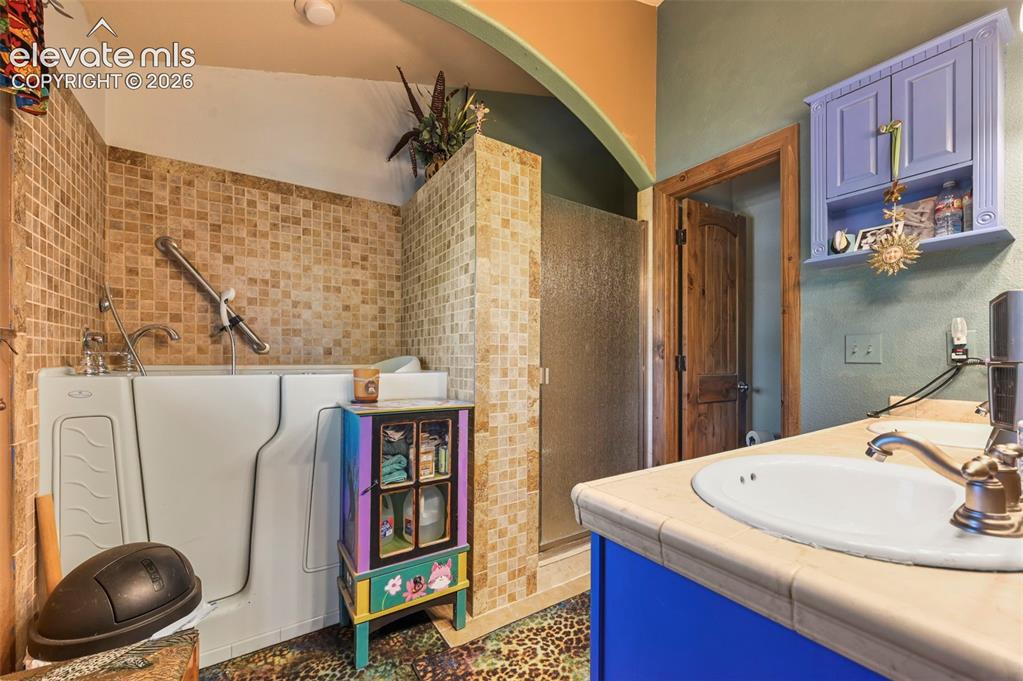 Image 12 of 43: Vibrant accent walls featuring a floral motif