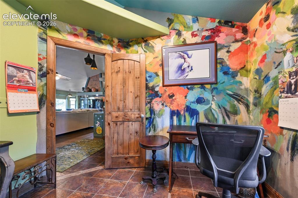 Image 13 of 43: Vibrant accent walls featuring a floral motif