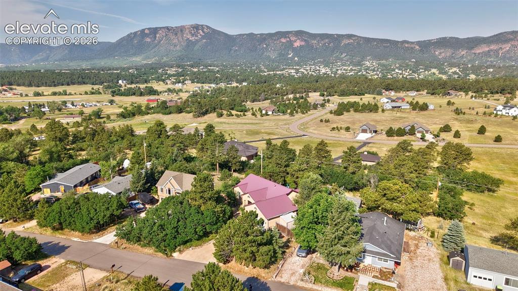 Image 37 of 43: Expansive aerial perspective showcasing a residential area with varied home