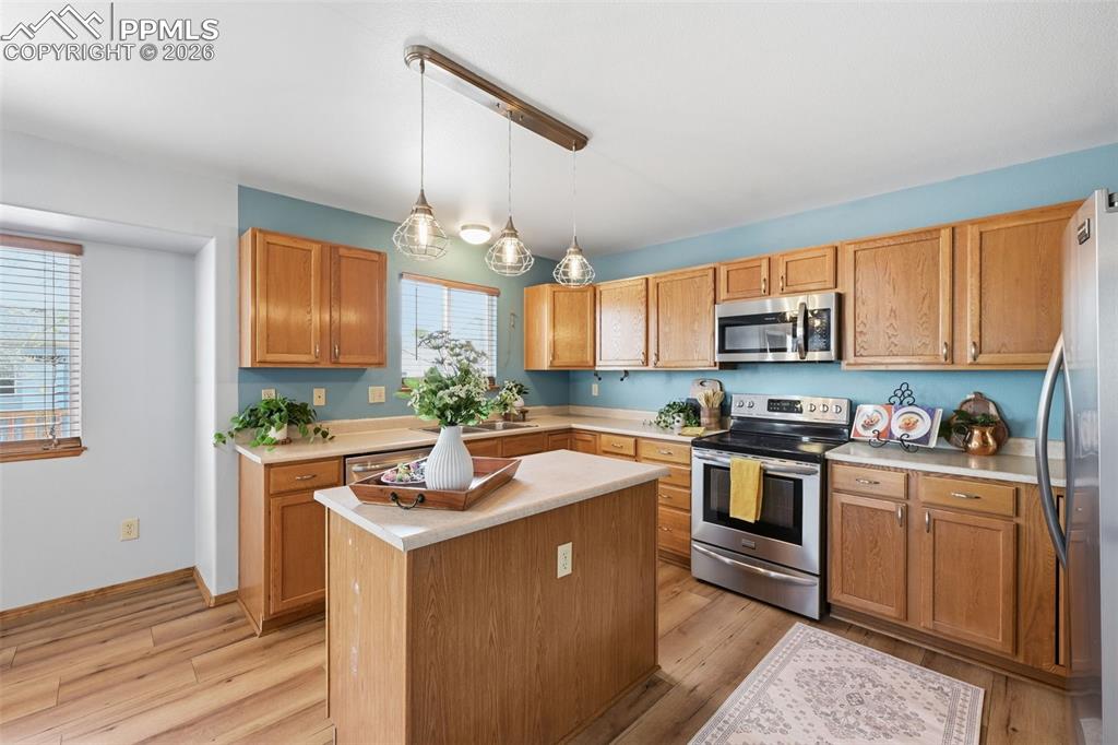 Image 11 of 42: Great counter space and cabinet storage and a pantry closet!