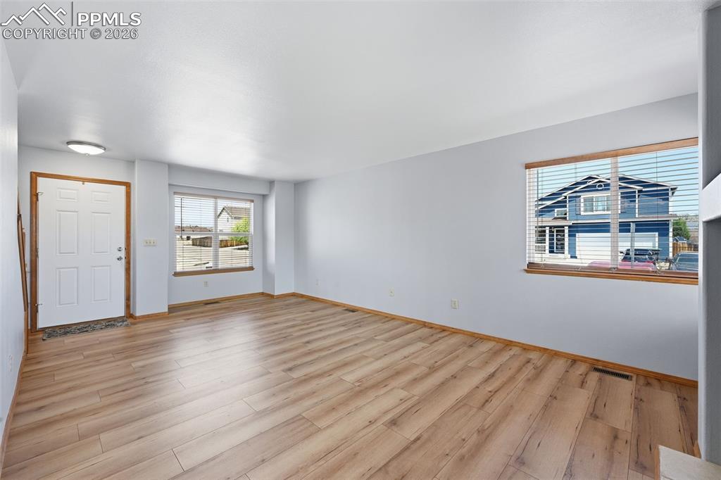 Image 4 of 42: Living room and entry area