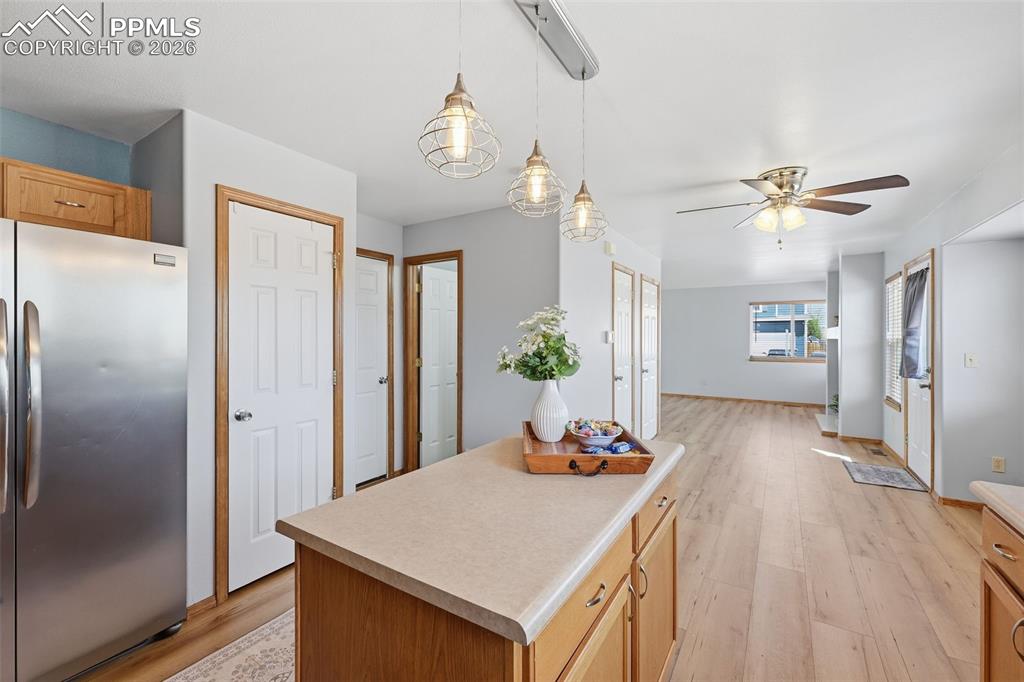 Image 9 of 42: Kitchen looking towards dining area and living room