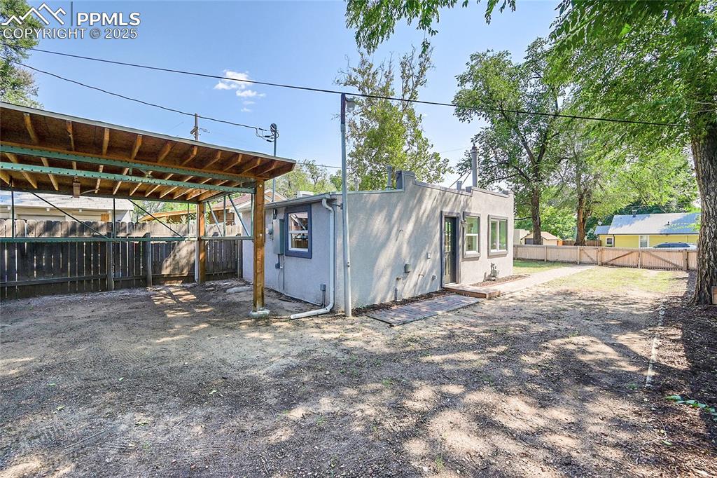 Image 24 of 30: View of outdoor structure with a fenced backyard